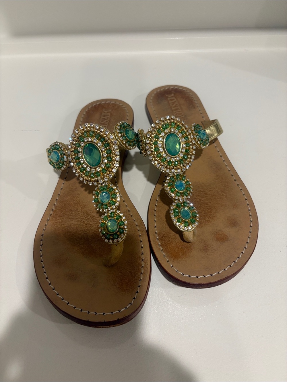 Mystique Boutique Gold Sandals with Green Gem Accents